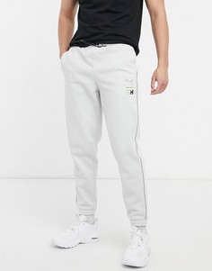 Серые спортивные штаны с полосками и логотипом PUMA x Helly Hansen-Серый